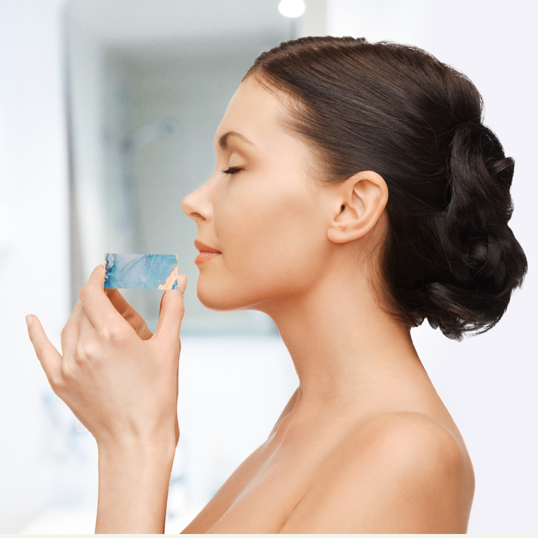 brunett woman getting into shower smelling how good our soaps smell