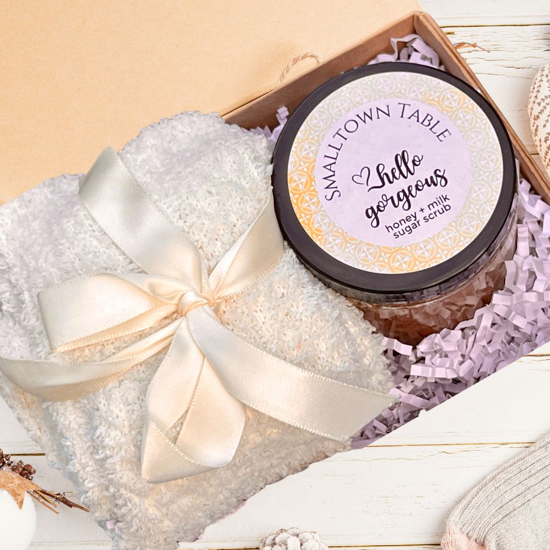 cozy white knee high socks wrapped in ribbon and milk and honey body butter