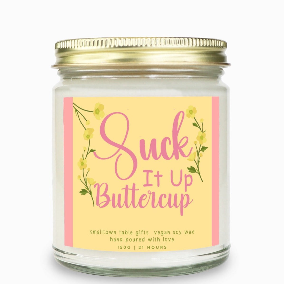 clean glass candle with gold lid label is pink on side, yellow background that says Suck it up buttercup yellow flowers with greens around the words