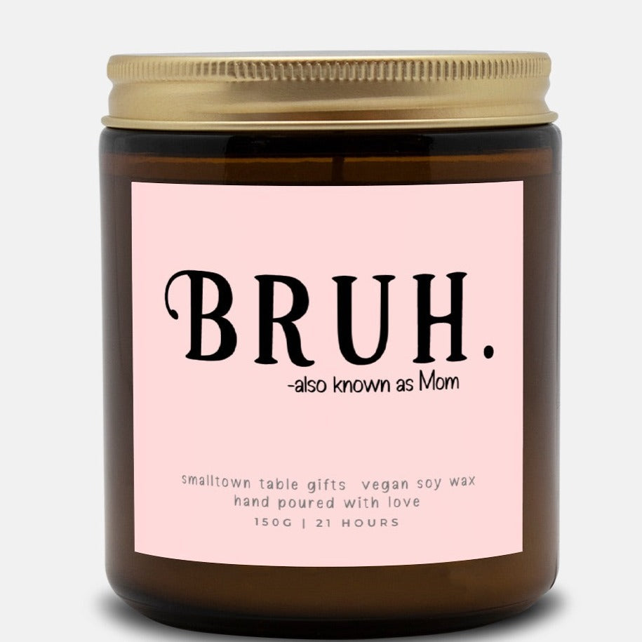 Amber glass jar candle with BRUH.-also known as Mom on the label in light pink