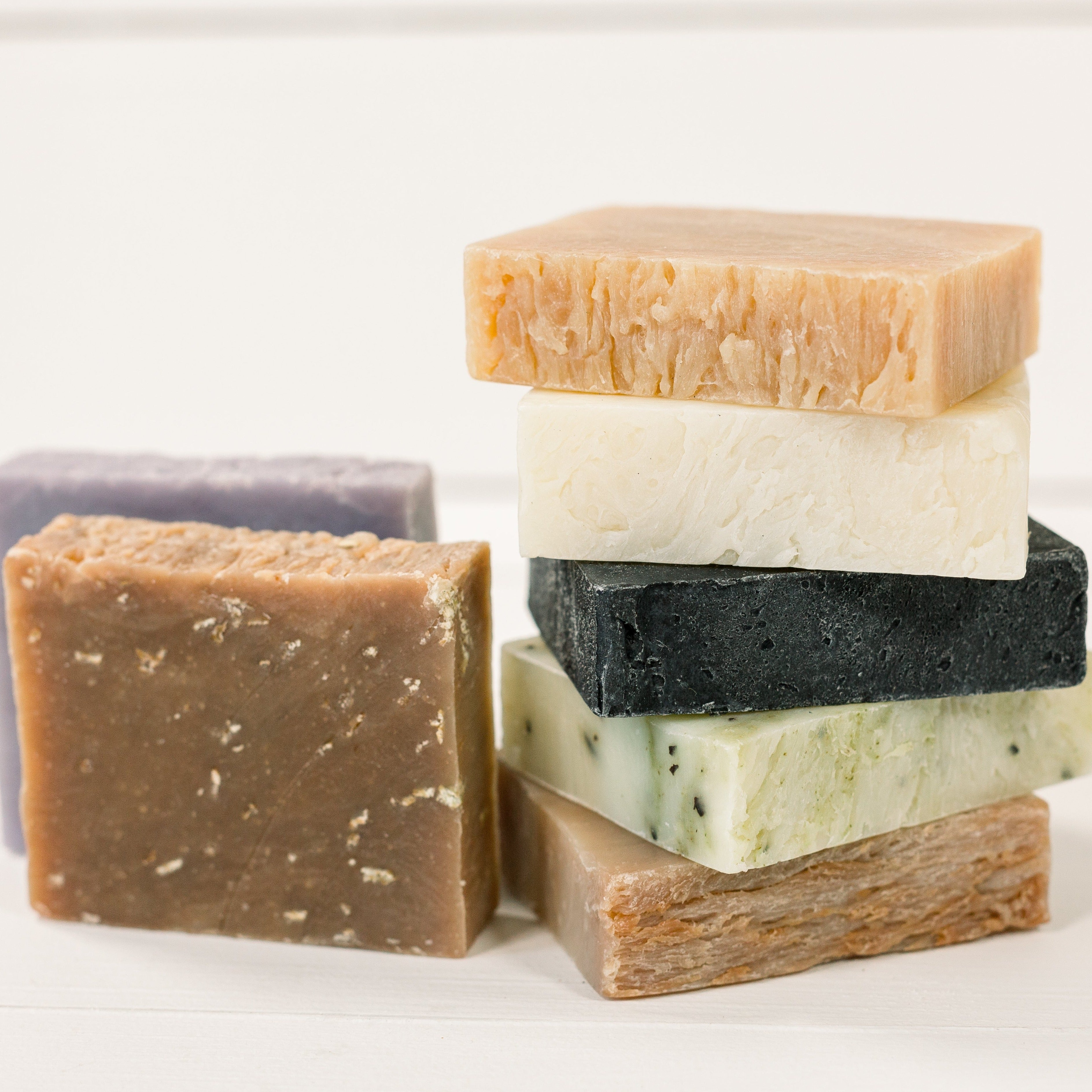 handmade all natural soaps stacked without packaging. pure 7 soaps